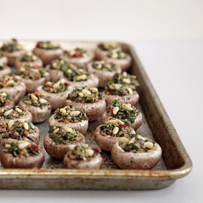 mushrooms filled with quinoa and nuts, easy vegetarian appetizers, in a metal tray