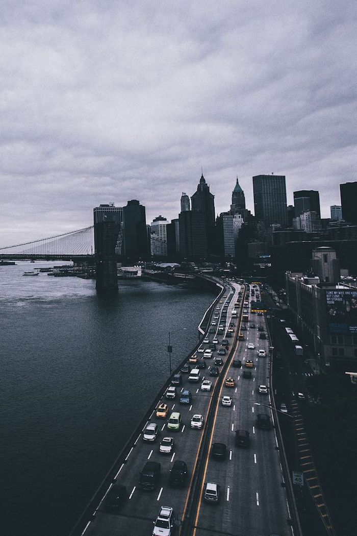 cars going down a highway, next to the ocean, new york city landscape, tumblr desktop backgrounds, grey sky