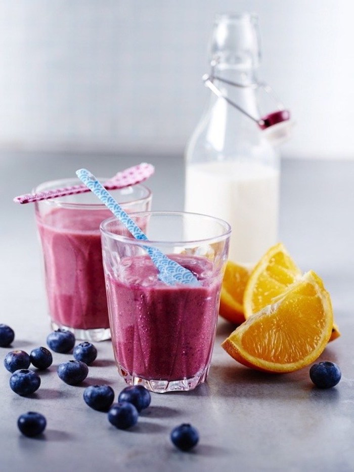 milk in a bottle, blackberries and oranges, how to make a mango smoothie, red and blue small spoons