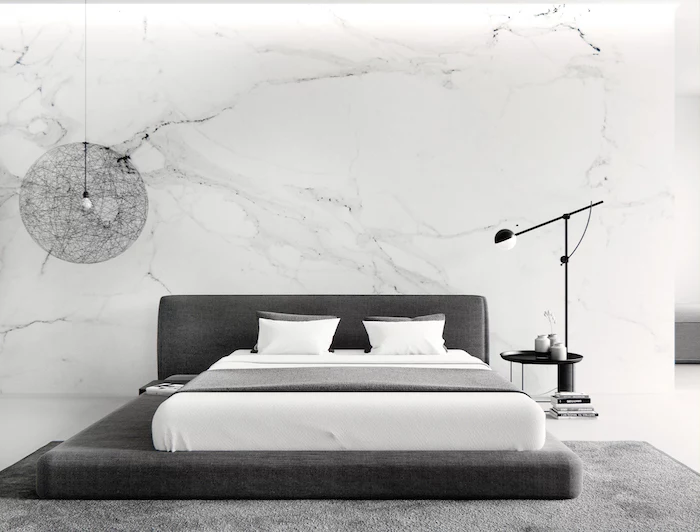 master bedroom ideas, marble wall, dark grey bed, grey carpet, black metal night stand