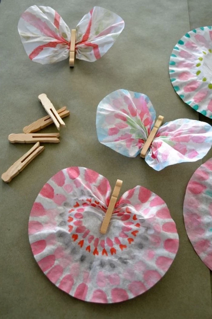 colourful butterflies, made of paper, and clothespins, indoor group games for kids