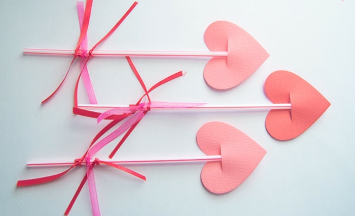 indoor group games for kids, paper hearts, with plastic straws, white background