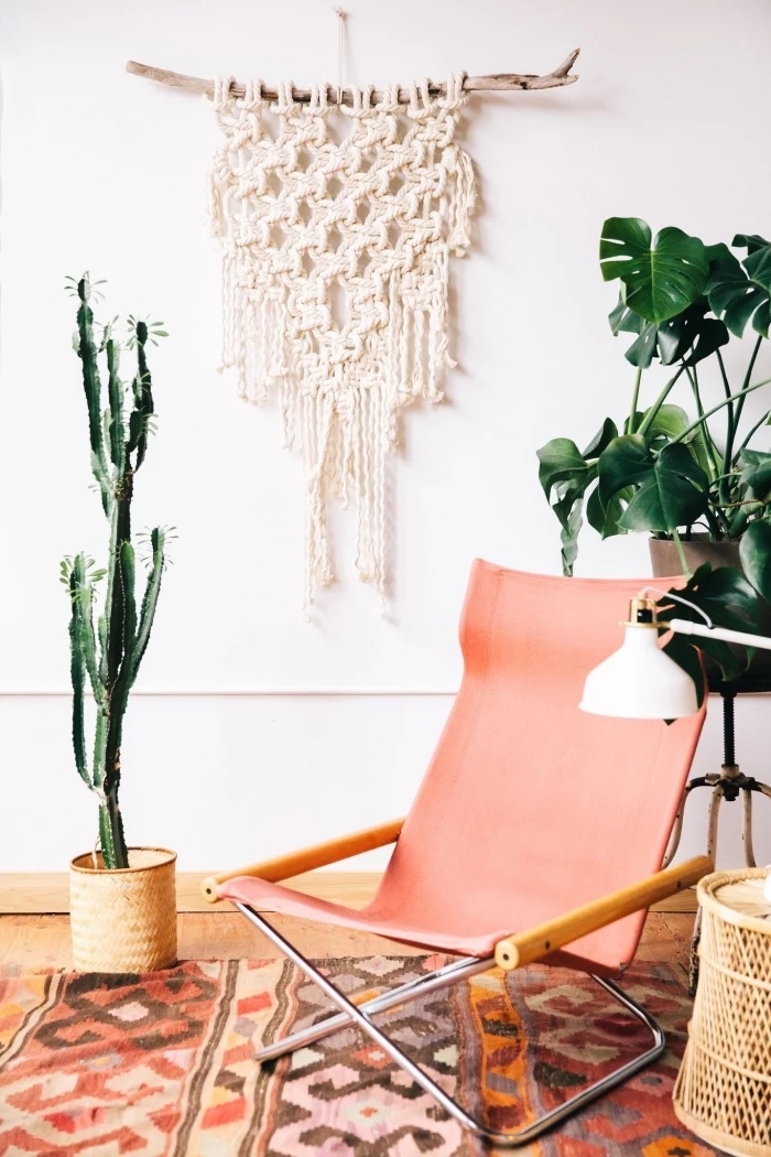 light pink chair, potted cactus, how to do macrame, white wall, printed rug