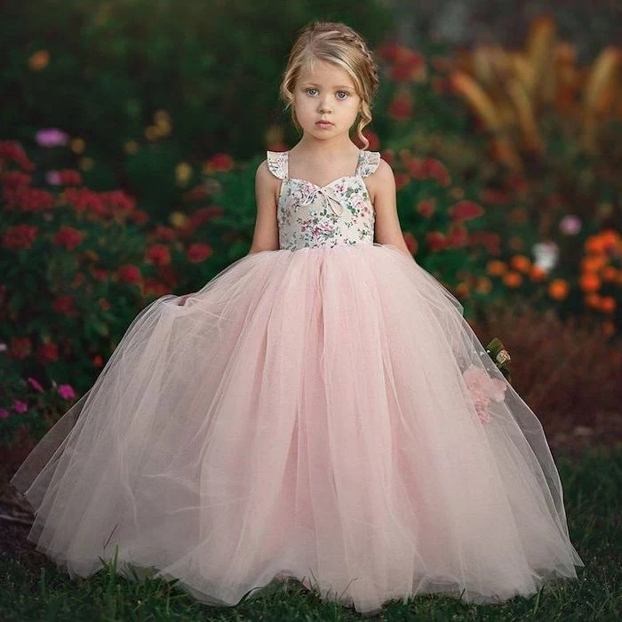 floral top, pink tulle bottom, blonde braided hair, flowers in the background, cute dresses for girls