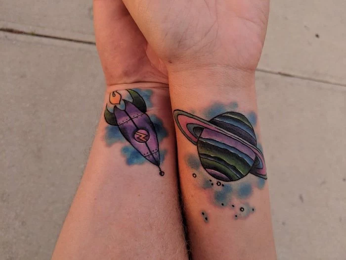 planet and rocket ship, watercolour wrist tattoos, couple finger tattoos
