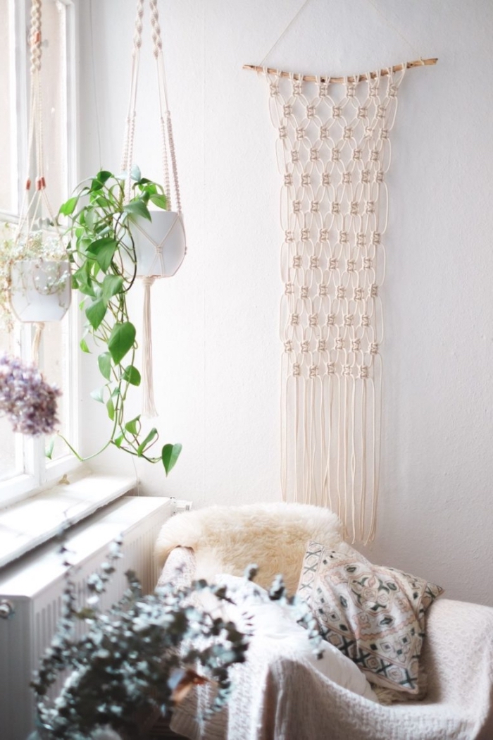 potted plants, plant hangers, macrame patterns, white wall, white furry blanket