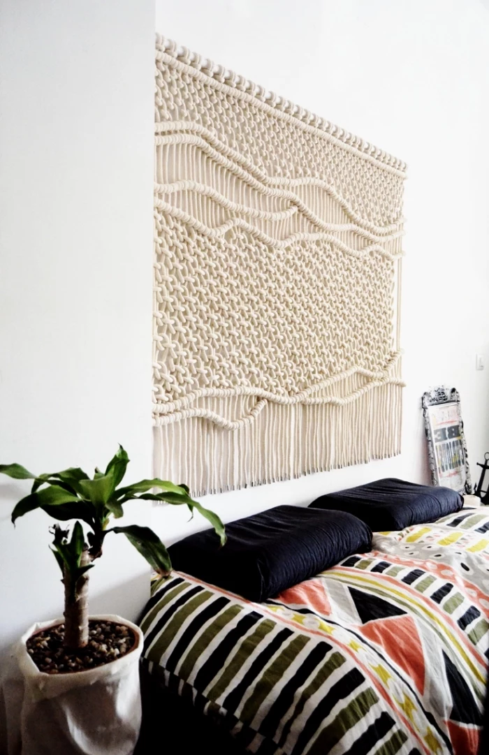 macrame for beginners, black pillows, colourful blanket, white walls, potted plants