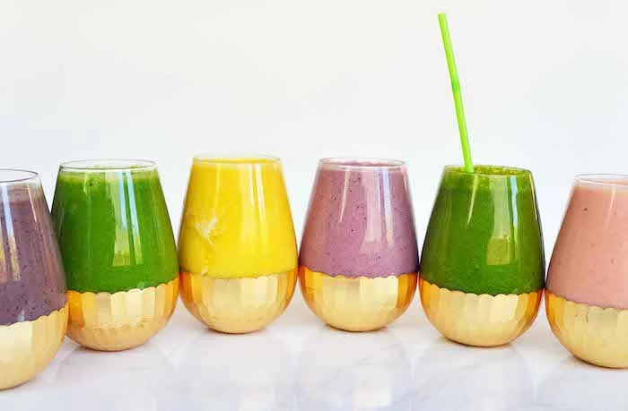 fruit smoothie recipes, different ingredients, colourful smoothies, in glasses with gold bottom