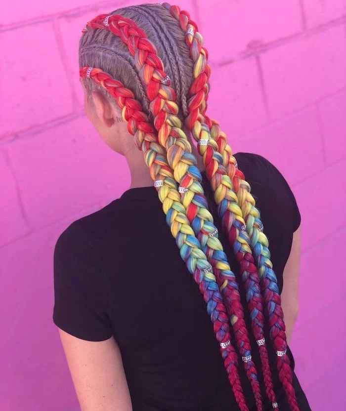 rainbow coloured braids with beads, cute braid styles, pink brick wall, girl wearing a black top