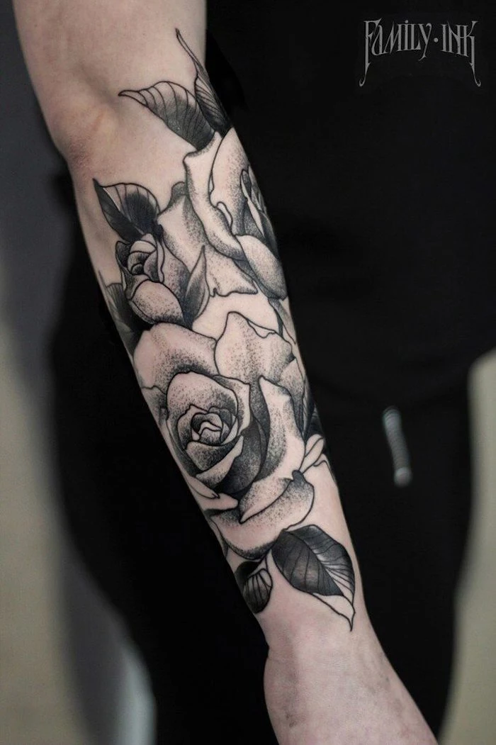floral forearm tattoo, tattoo ideas for men arm, black shirt, black pants
