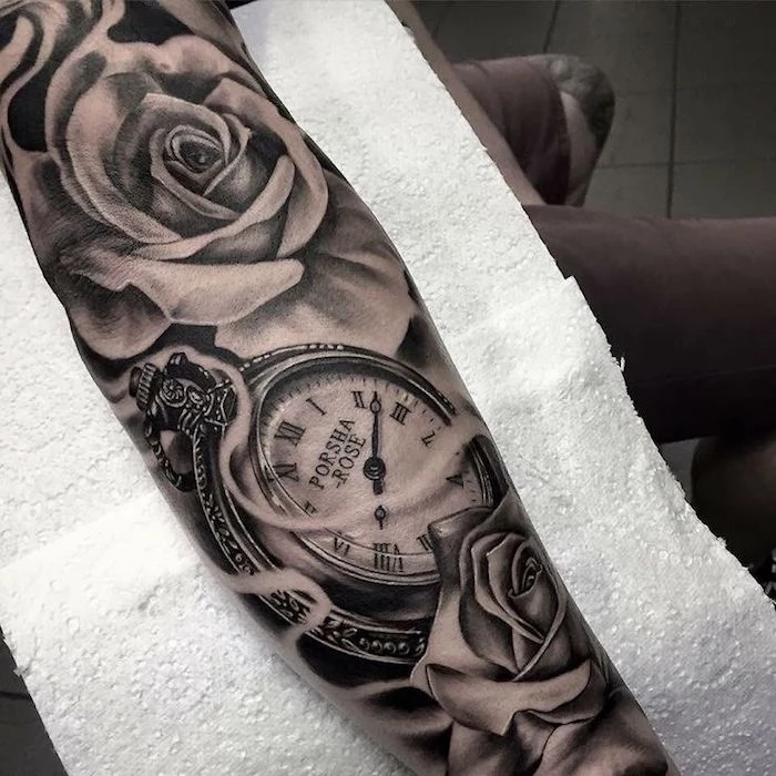 pocket watch with roses, hand on white paper, tattoo ideas for men arm