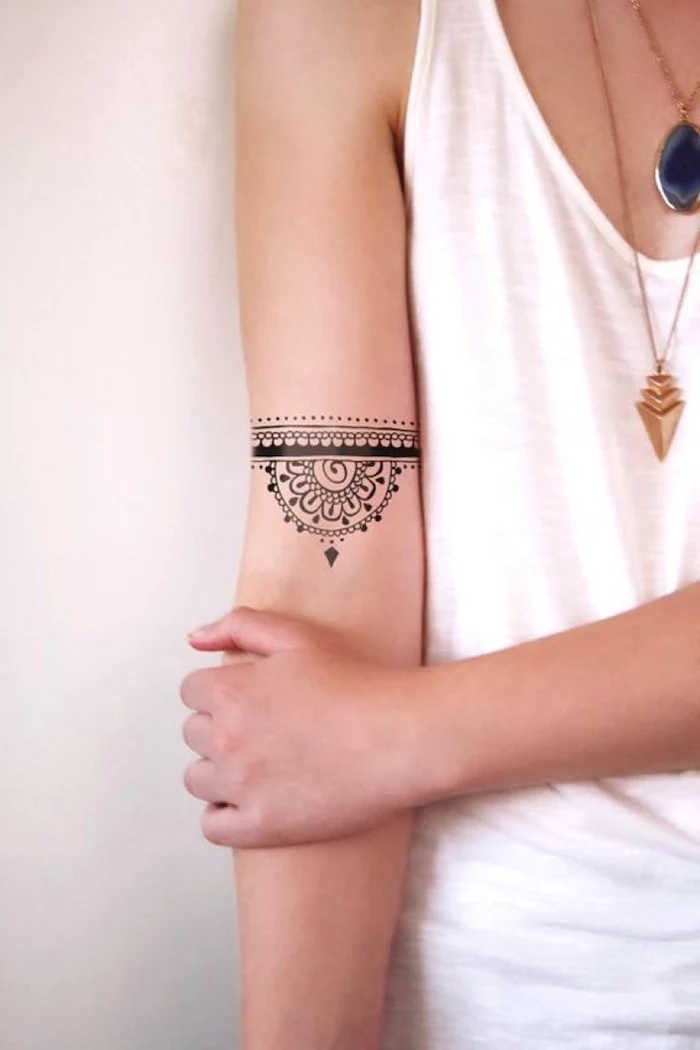 white top, tattoos for girls on hand, gold necklaces, mandala inside arm tattoo