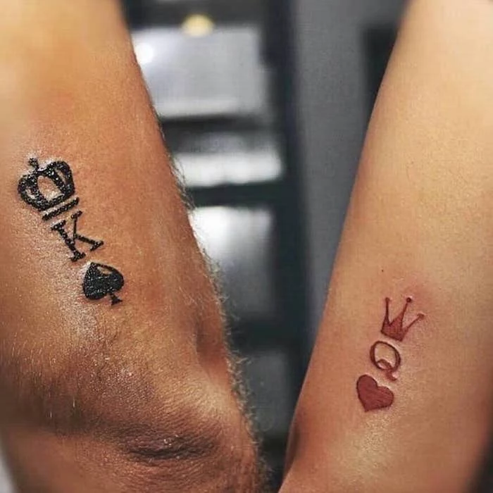 king of spades, queen of hearts, his and hers matching tattoos, back of arm tattoos