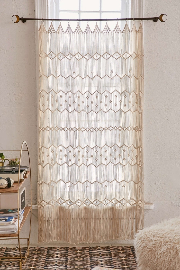 macrame curtain, woven wall tapestry, white wall, metal bookshelf, furry blanket