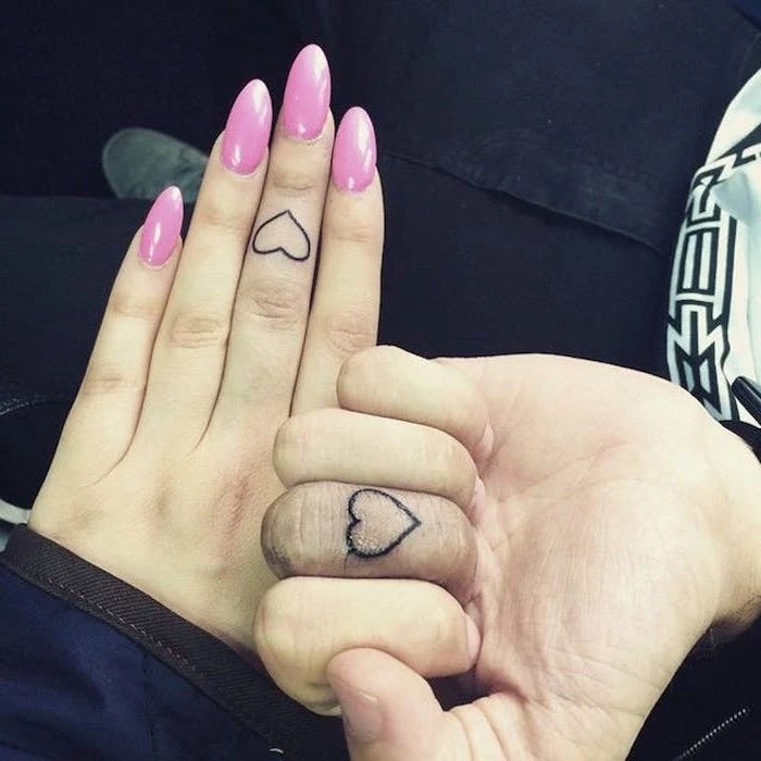 heart outlines, finger tattoos, his and hers matching tattoos, long pink nails