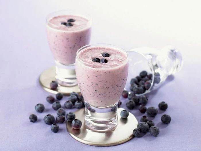metal coasters, blueberries scattered around, healthy breakfast smoothie recipes
