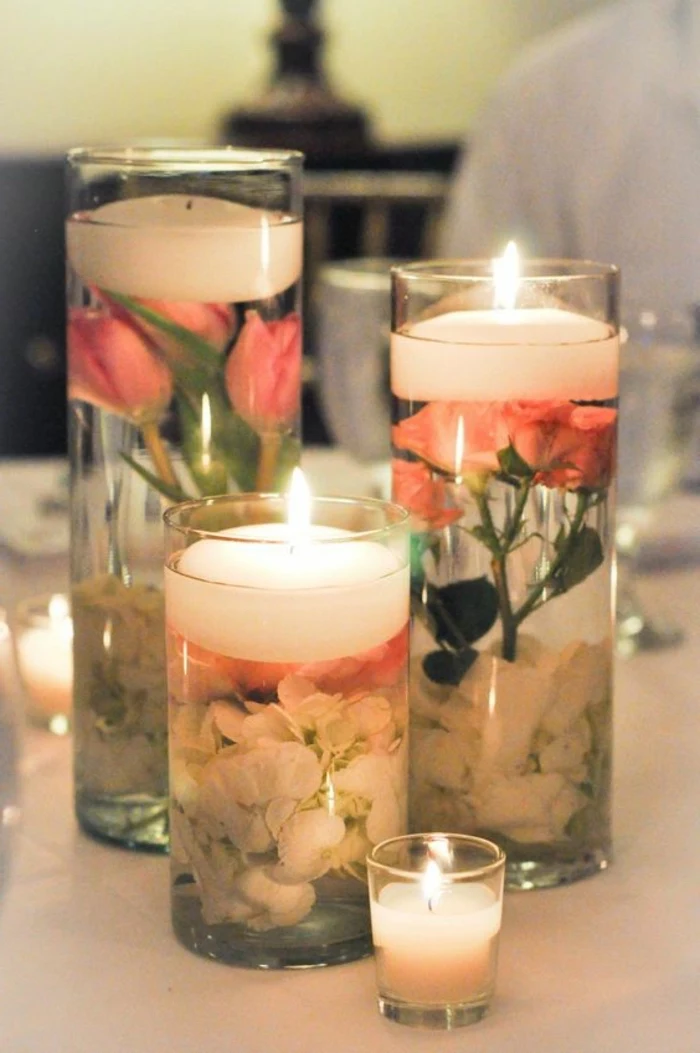 tall round vases, filled with water and flowers, candles on top, how to make candles at home