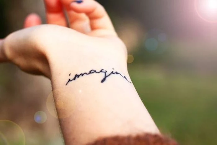 imagine wrist tattoo, meaningful tattoo ideas, blurred background