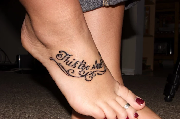 this too shall pass, meaningful tattoo ideas, leg tattoo, red nail polish