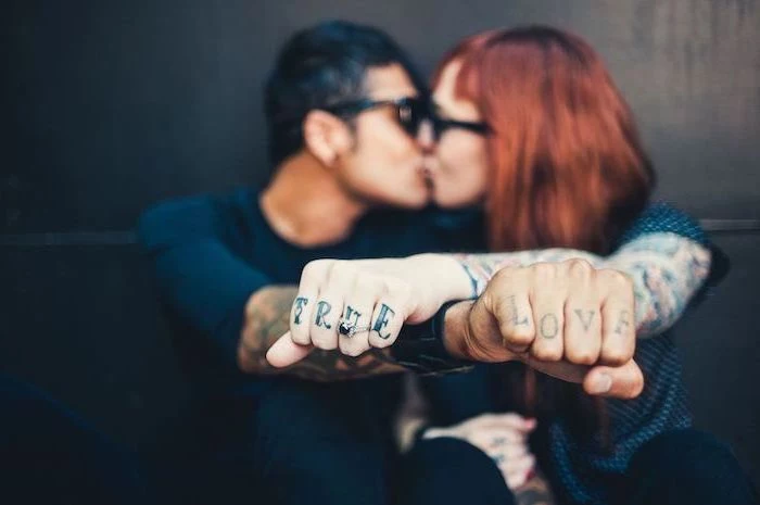 true love, finger tattoos, couple kissing, black background, married couple tattoos