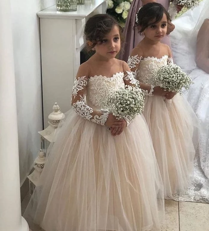 two girls, in ivory lace and tulle dresses, toddler flower girl dresses, baby's breath bouquets