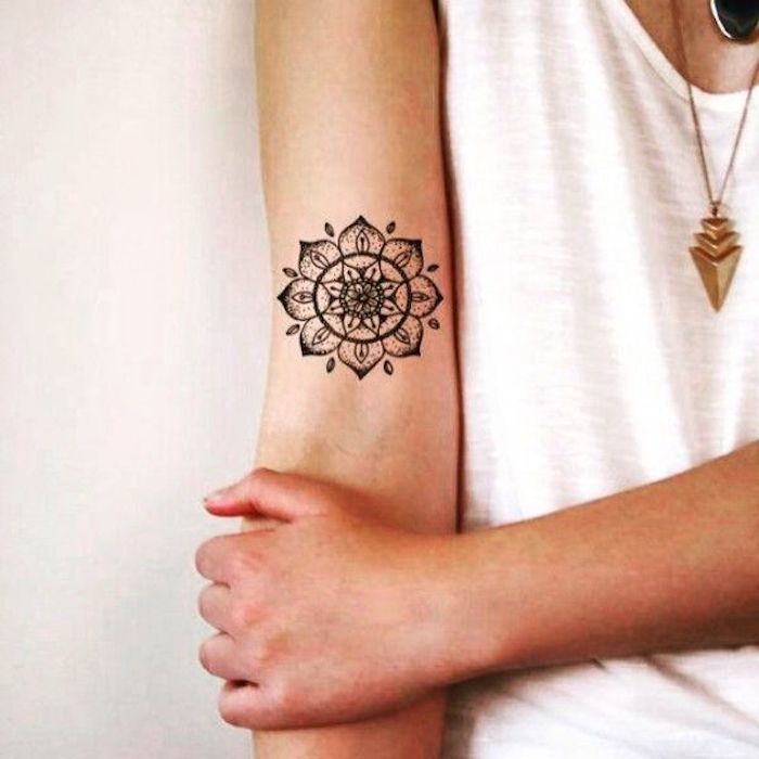 female tattoos gallery, mandala tattoo, inside arm tattoo, white top, gold necklaces