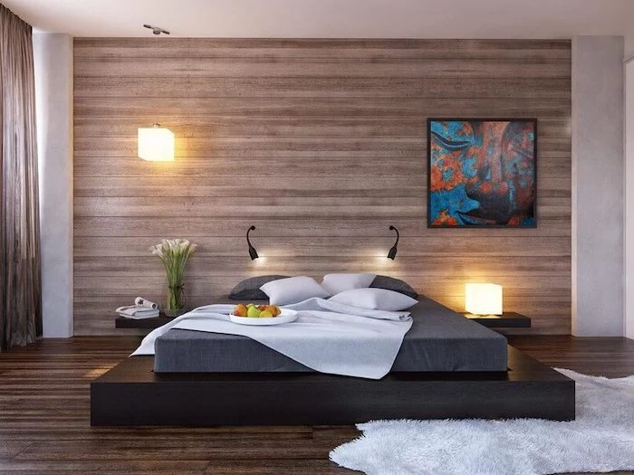 wooden accent wall, black bed frame, how to decorate a bedroom, wooden floor, white rug