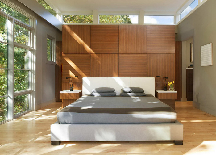 wooden tiled accent wall, grey walls, large windows, wooden floor, white bed frame, bedroom wall ideas