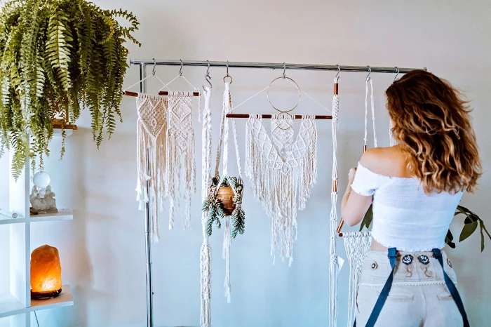 potted plant, wooden shelf, how to macrame, hanging macrame, woman knitting, white wall