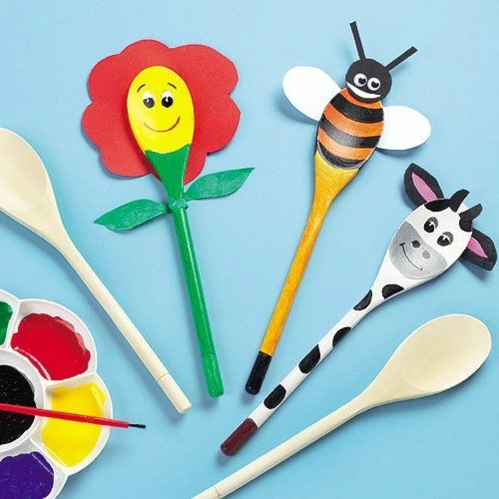 small group activities for preschoolers, wooden spoons, tuned into animals, cow and bee, red flower
