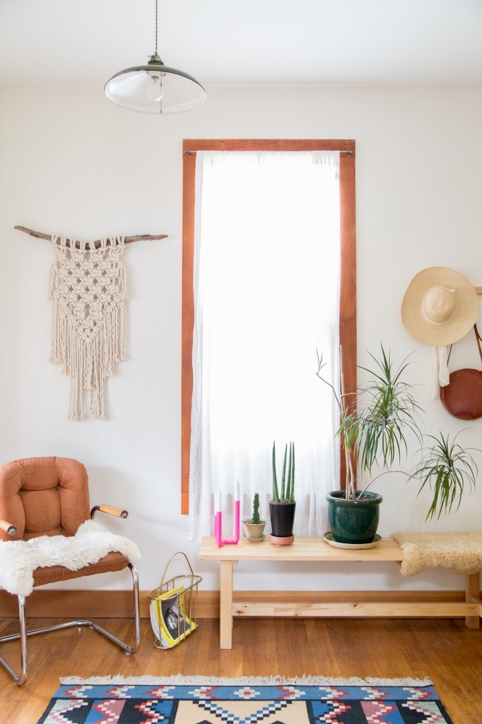 leather armchair, wooden floor, white wall wooden table, potted plants, macrame wall hanging diy