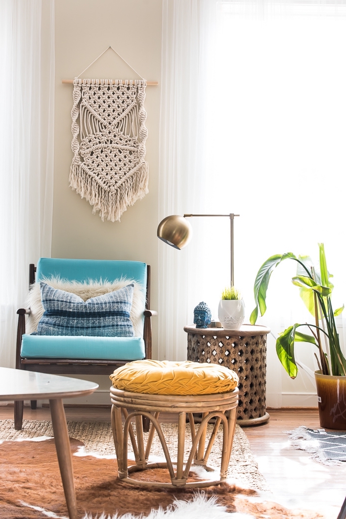 blue armchair, wooden ottoman, brass metal lamp, potted plants, learn macrame, blue throw pillow