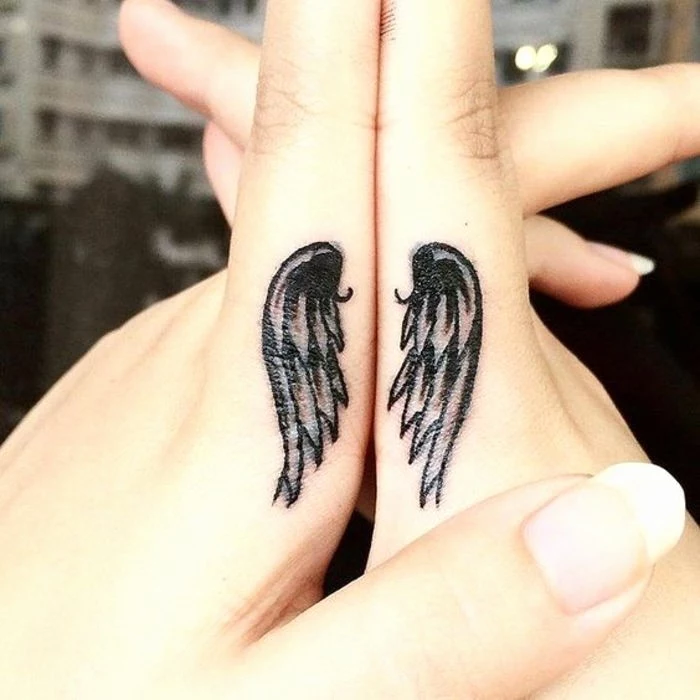 angel wings, finger tattoos, intertwined hands, matching bestfriend tattoos, long nails
