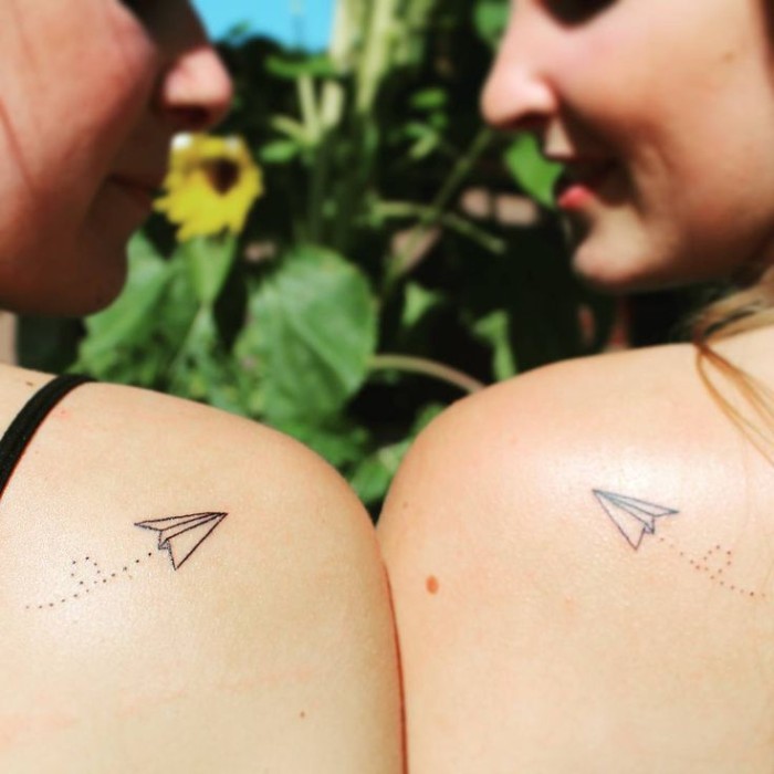paper airplanes, shoulder tattoos, matching bestfriend tattoos, sunflowers in the background