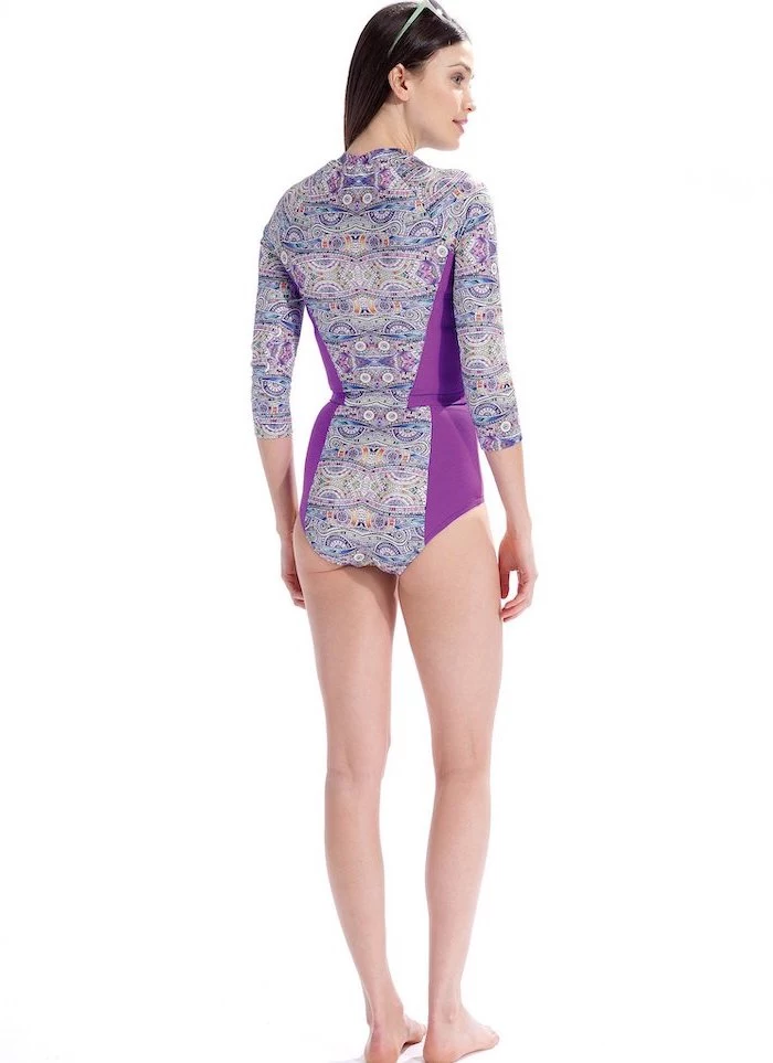 one piece, with long sleeves, purple print, long brown hair, girls one piece swimsuit