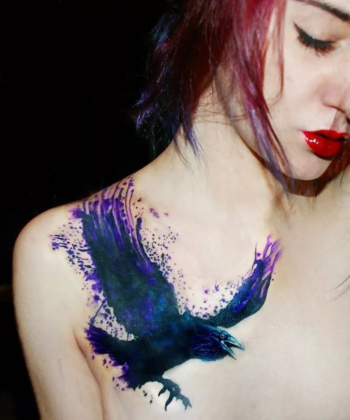 red lipstick, flower tattoos, bird with spread wings, watercolor shoulder tattoo