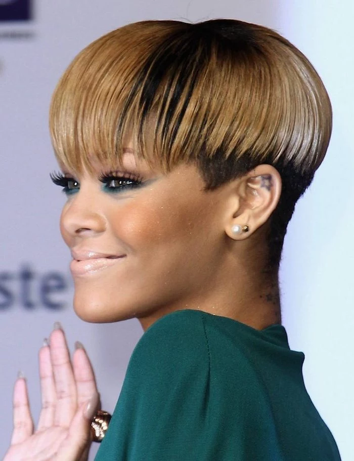 rihanna smiling, african american short hairstyles, wearing a green dress, with blonde hair