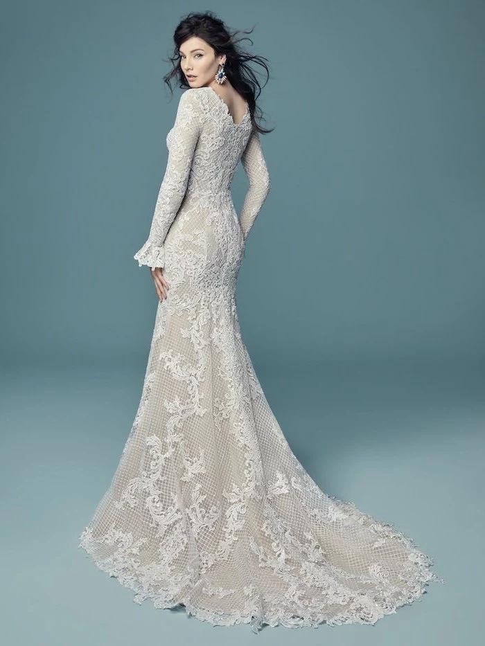 long black wavy hair, long sleeve lace wedding dress, blue background