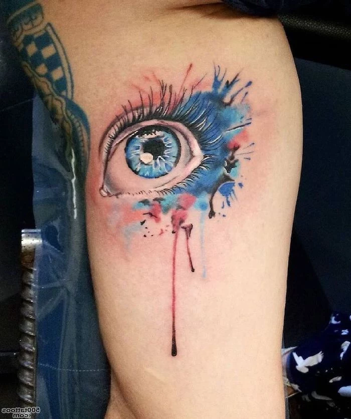 blue eye, delicate flower tattoos, watercolor inside arm tattoo