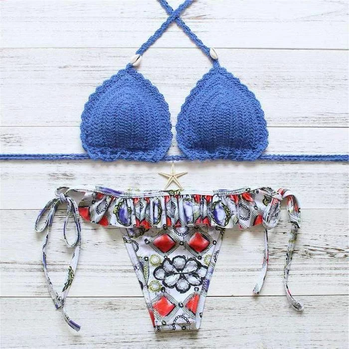 blue knitted top, printed colourful bottom, toddler bathing suits, two piece, wooden background