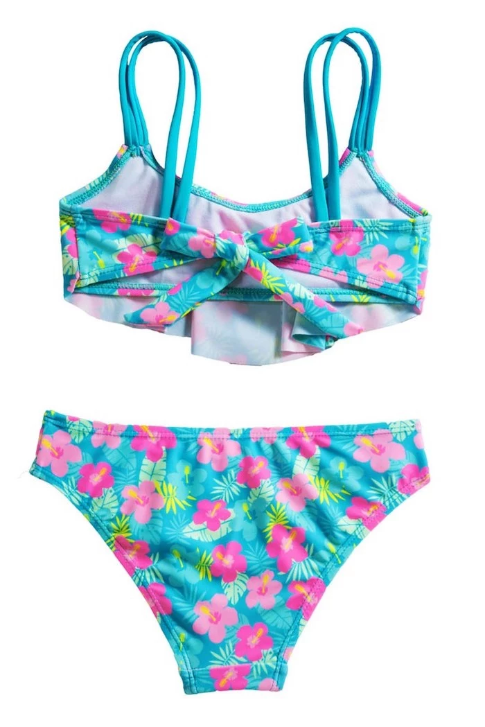 tween bathing suits, blue with pink flowers print, two piece, white background