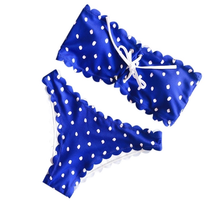 blue two piece, with white dots, white background, girls bathing suits, white straps
