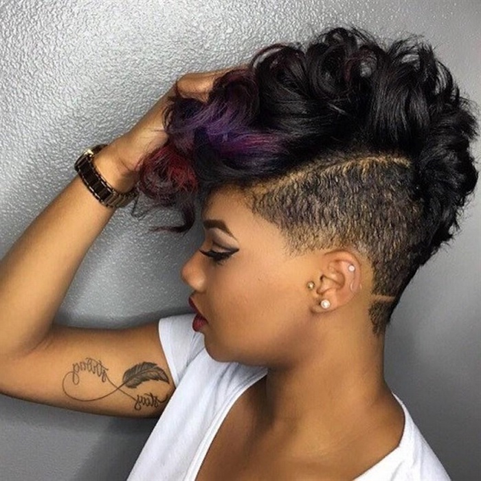 black short curly hairstyles, purple ends, black hair undercut, white shirt, inside arm tattoo