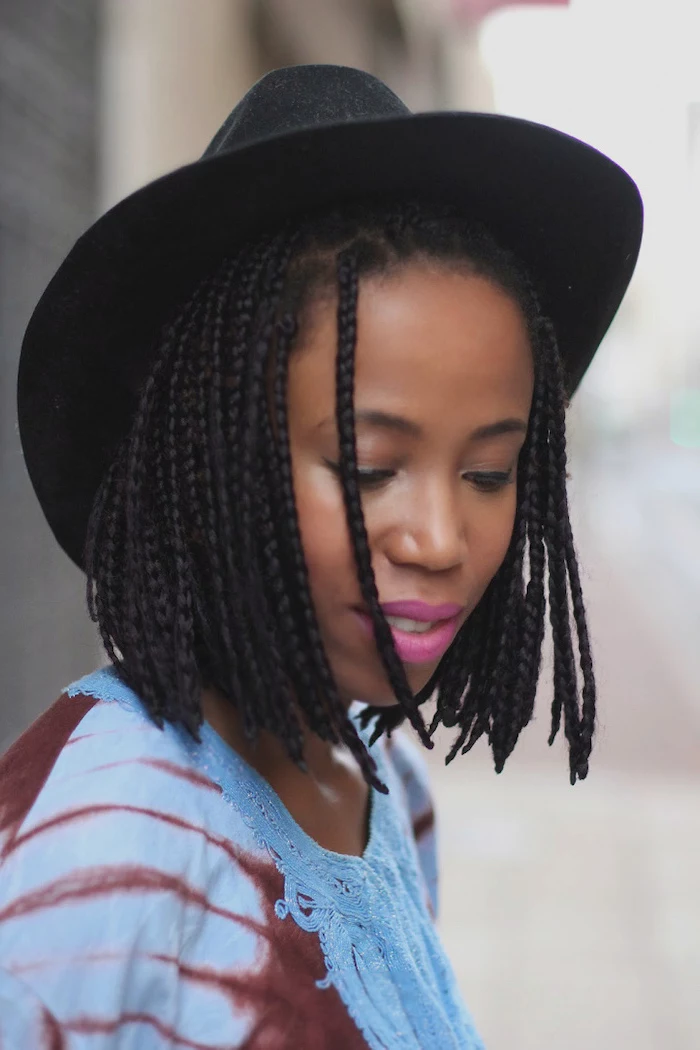 black hat, braided short hair, short haircuts for black women, pink lipstick, blue top