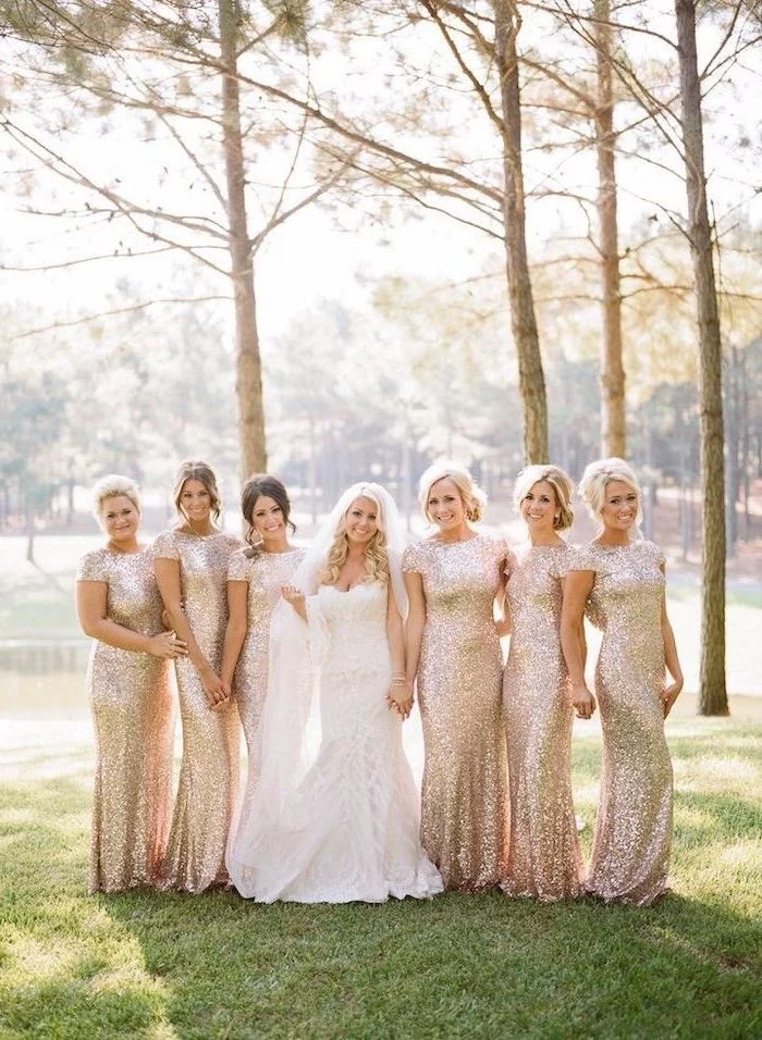 bride in the middle, rose gold sequin bridesmaid dresses, forest landscape
