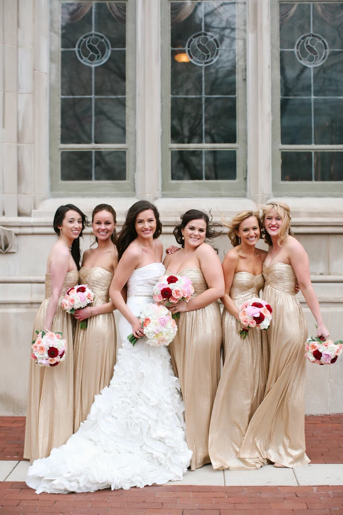bride in the middle, gold strapless dresses, rose gold bridesmaid dresses, colourful flower bouquet