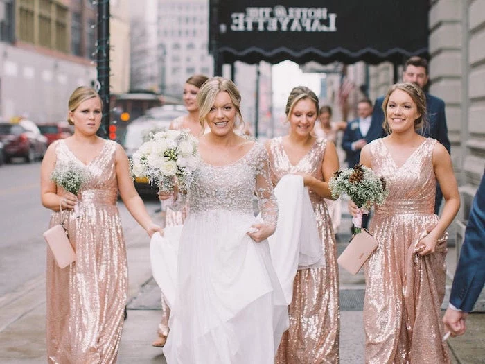 white flower bouquets, bride in the middle, rose gold sequin bridesmaid dresses
