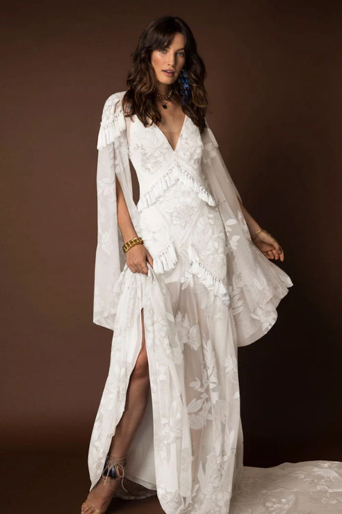 wide sleeves, long white lace dress, brown wavy hair, with bangs, fitted wedding dresses