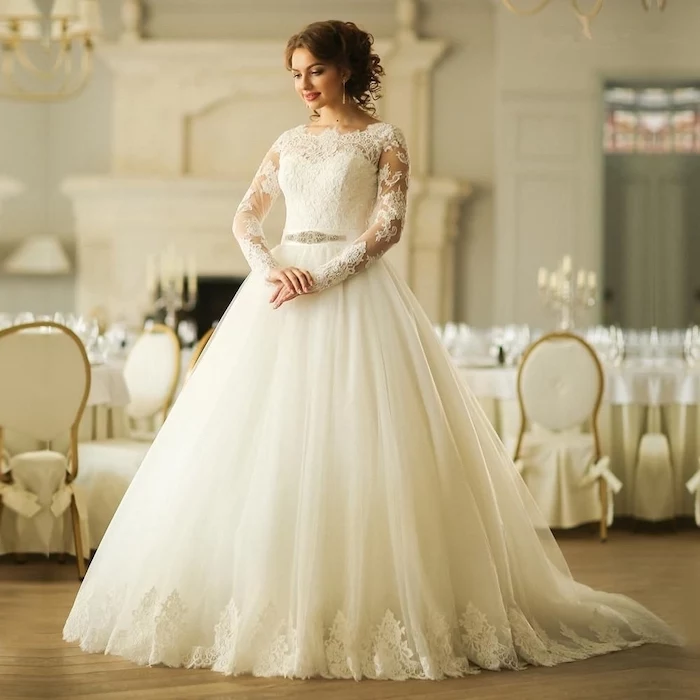 brown hair, in a high updo, flowy wedding dress, made of tulle and lace, wooden floor, lace sleeves