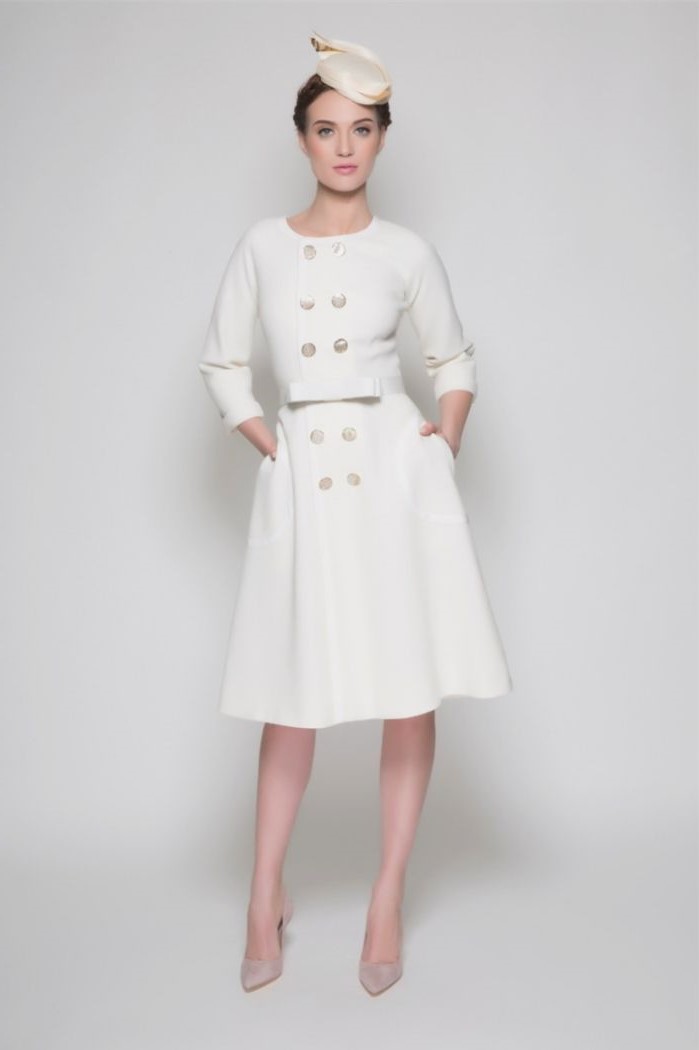 coat dress, in white, long sleeves, petite mother of the bride dresses, small hat, nude heels, brown hair, in a low updo